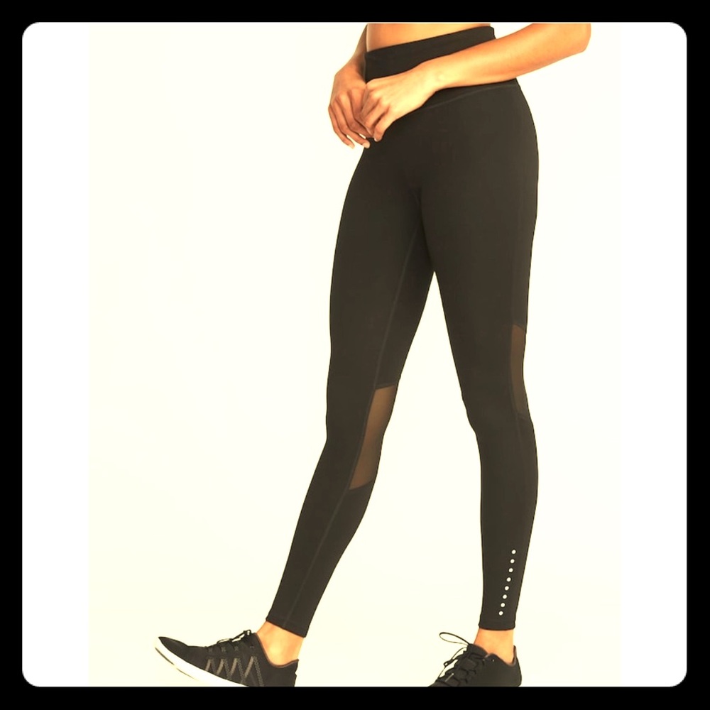 New and unused high rise leggings, mesh panels